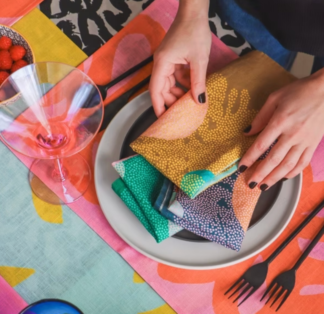Leila Simon Hayes' Cascade Dinner Napkins featured in Pride Journeys 2025 Holiday Gift Guide