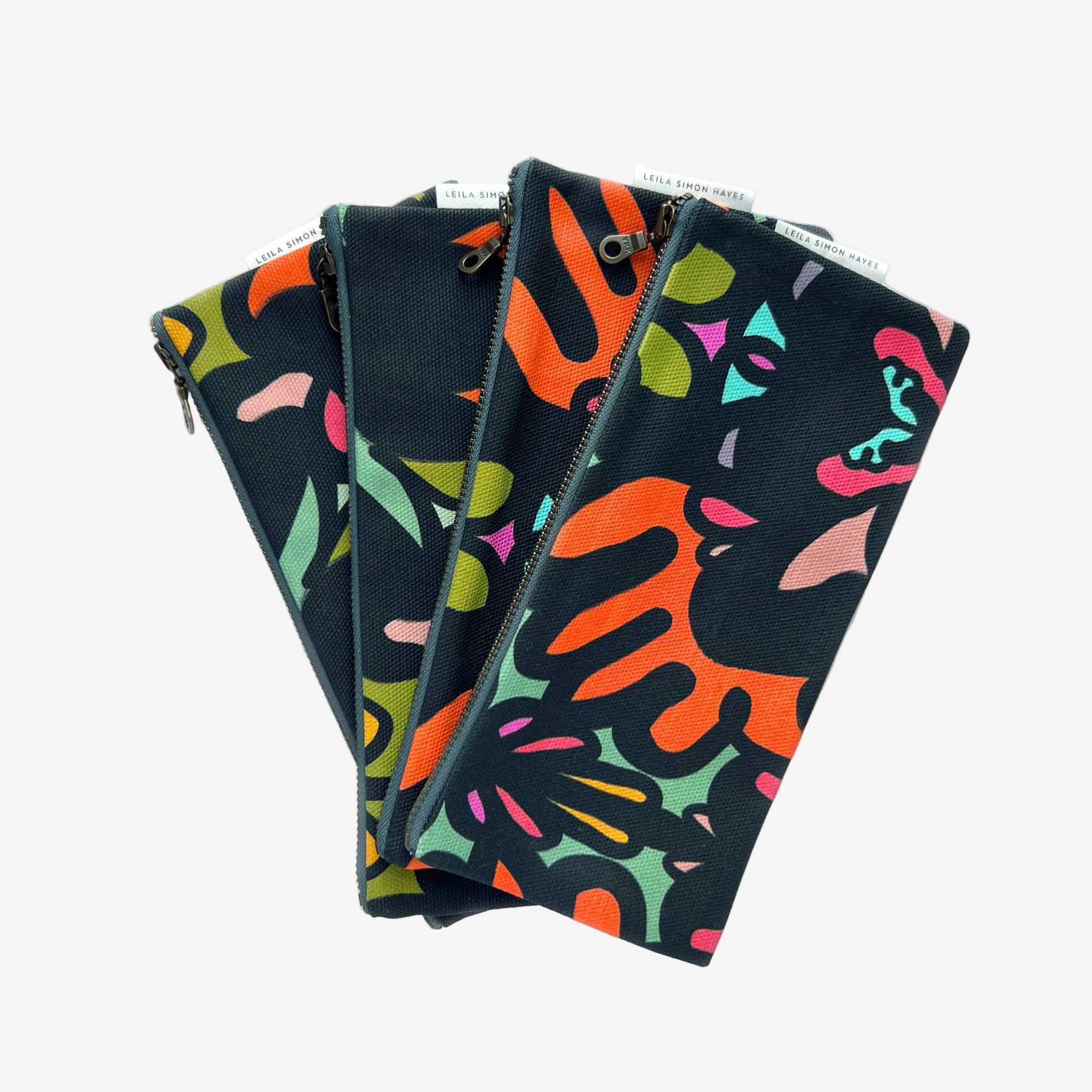 Four colorful patterned pouches on a white background