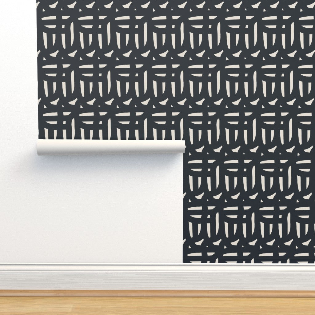 Roll of black and white wallpaper. Designed by artist Leila Simon Hayes.