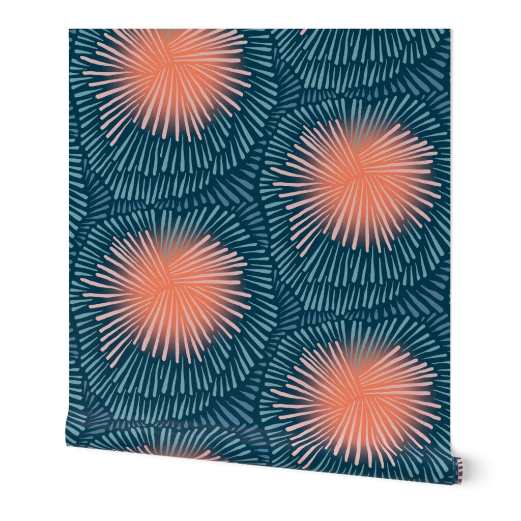 A swatch of removable wallpaper featuring a geometric pattern with orange and dark blue colors. Designed by artist Leila Simon Hayes.