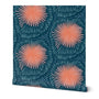 A swatch of removable wallpaper featuring a geometric pattern with orange and dark blue colors. Designed by artist Leila Simon Hayes.