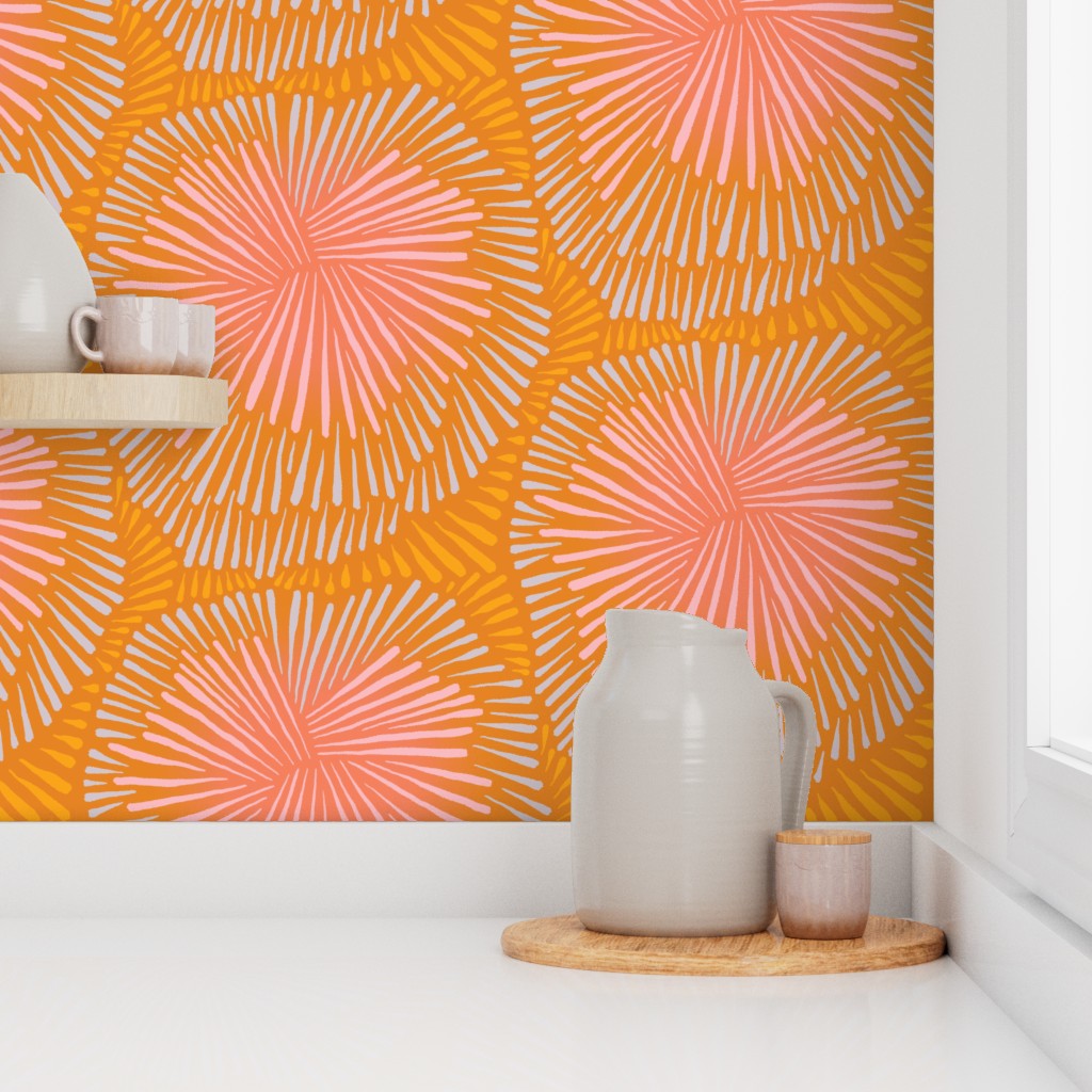 Sun burst wallpaper in orange. Designed by artist Leila Simon Hayes.
