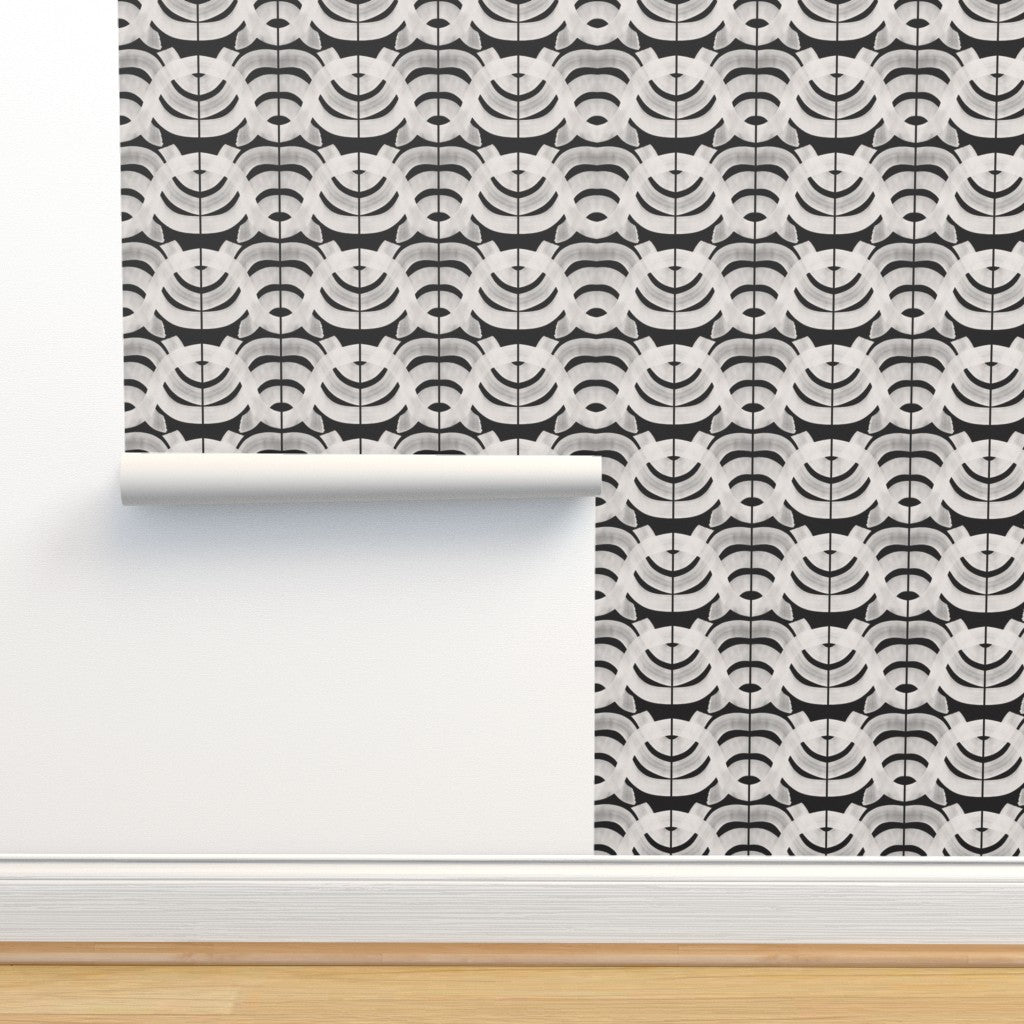 Roll of black and white abstract wallpaper. Designed by artist Leila Simon Hayes.