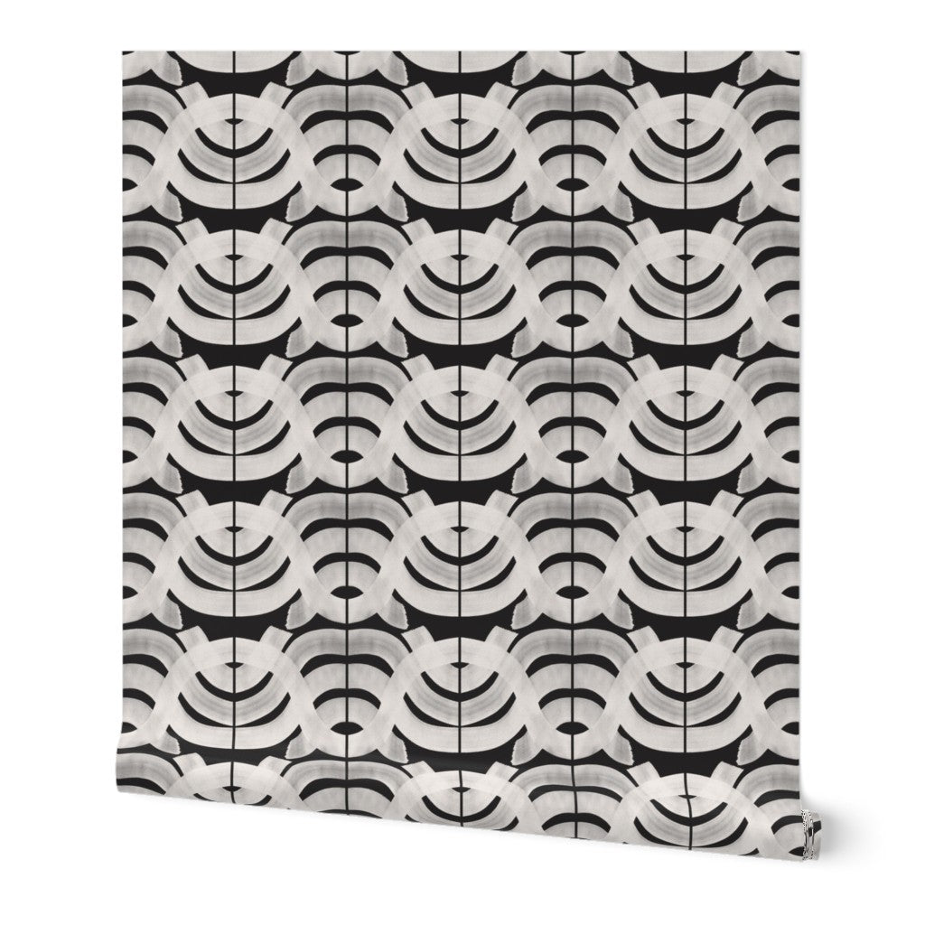 A roll of peel-and-stick removable wallpaper featuring a geometric pattern in black, white, and gray tones. Designed by artist Leila Simon Hayes.