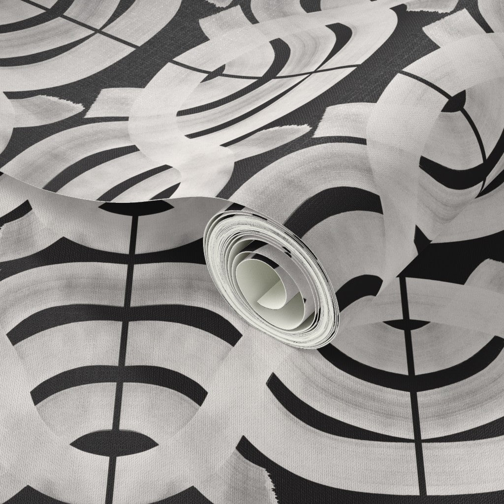 Roll of wallpaper with black and white abstract pattern. Designed by artist Leila Simon Hayes.