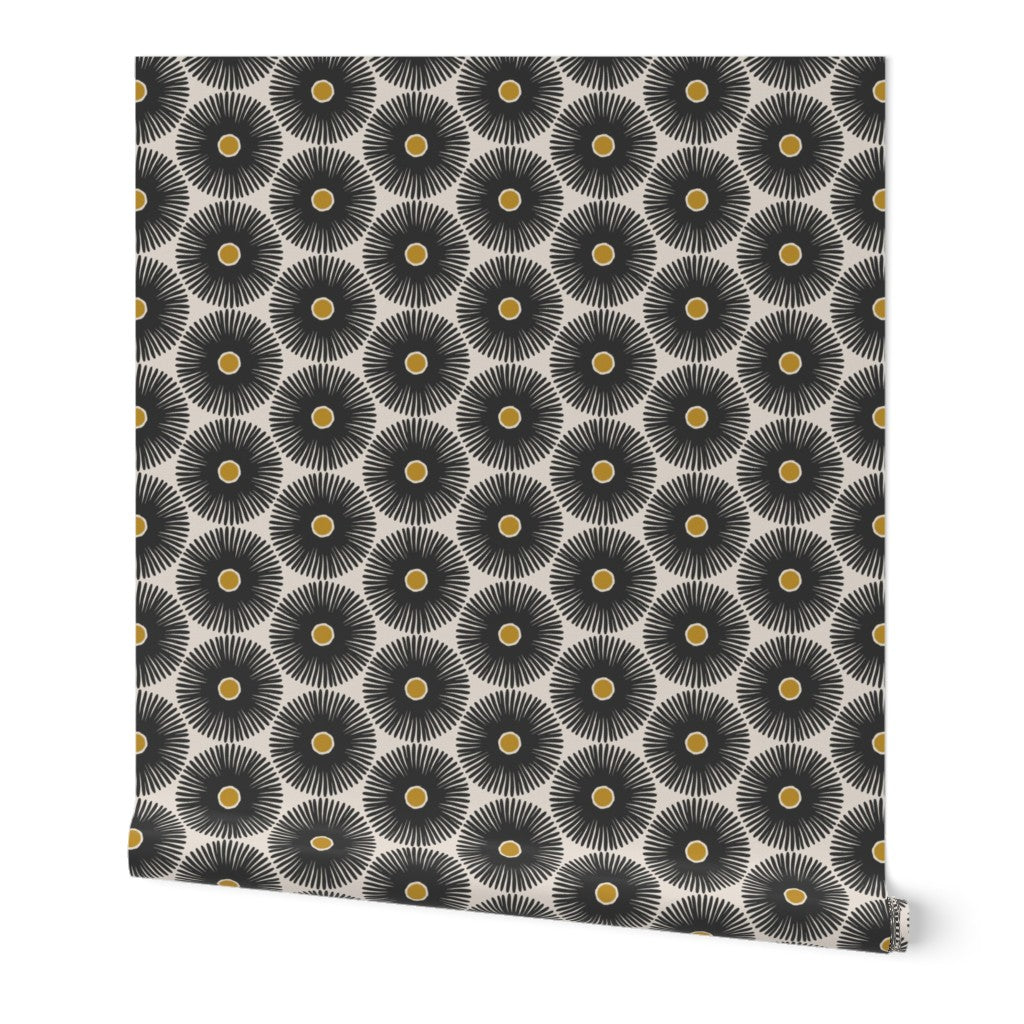 A roll of peel-and-stick black and white wallpaper featuring a hand-painted floral design with yellow accents. Designed by artist Leila Simon Hayes.