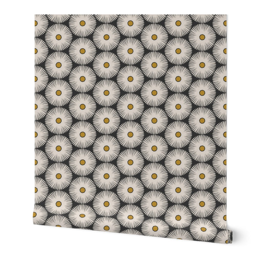 A wallpaper featuring a repeated geometric pattern with sunflower-like designs in black and white with yellow centers. Designed by artist Leila Simon Hayes.