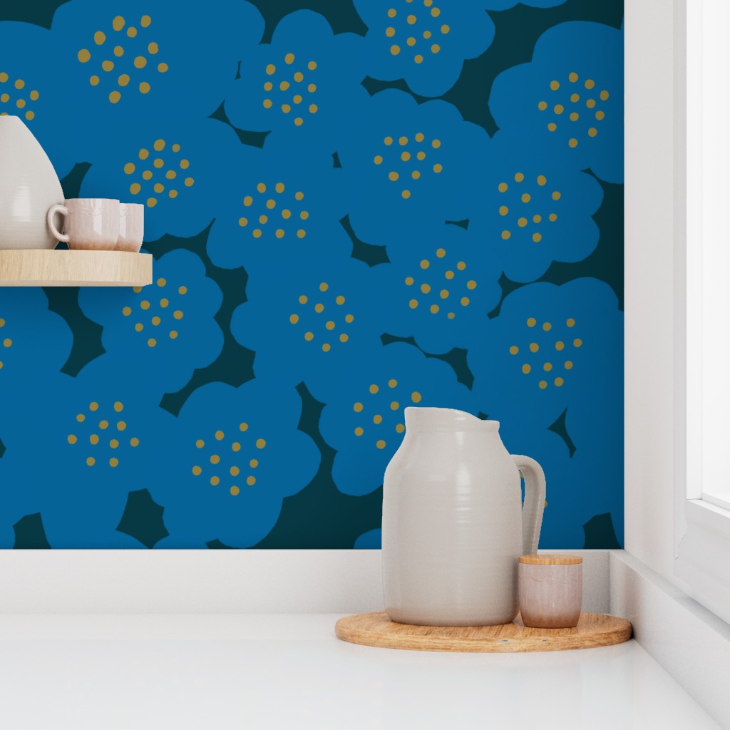 Blue floral wallpaper with a flower pattern in a room, featuring a white cup and a grey vase on a wooden stand. Designed by artist Leila Simon Hayes.
