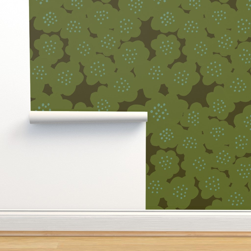 Green floral wallpaper on a wall. Designed by artist Leila Simon Hayes.