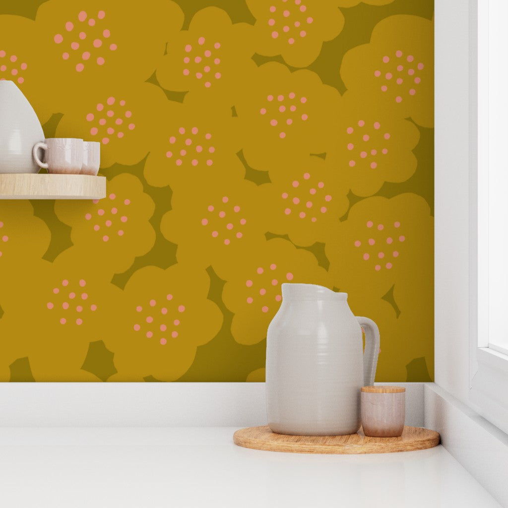 A room with yellow wallpaper featuring a floral pattern, with decorative items on a white surface against a yellow wall. Designed by artist Leila Simon Hayes.
