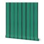 Roll of bright green and dark green wallpaper with vertical stripes. Designed by artist Leila Simon Hayes.