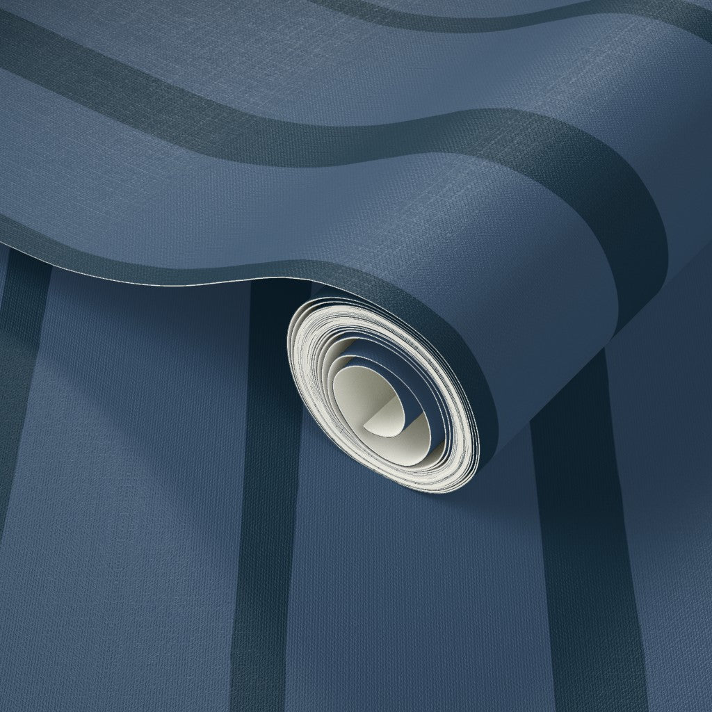 Roll of blue wallpaper with a blue stripe pattern. Designed by artist Leila Simon Hayes.