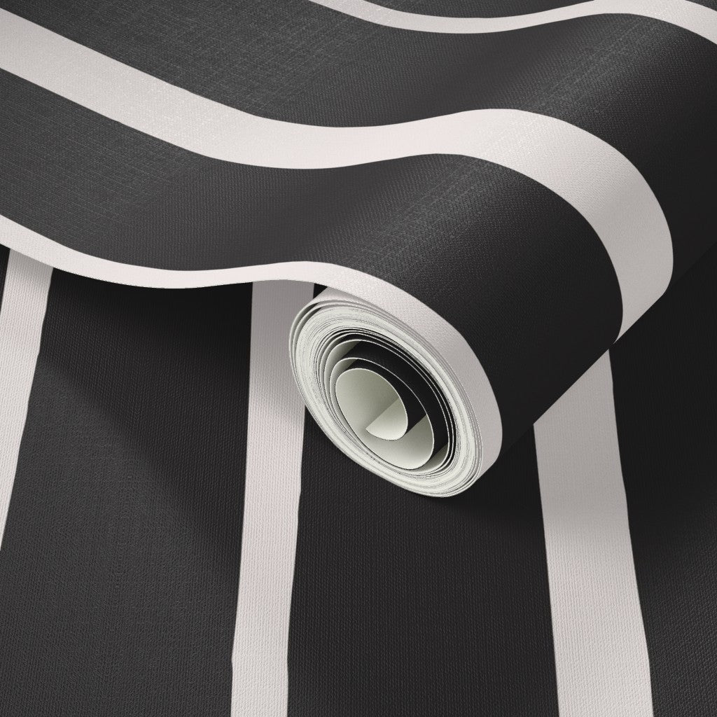 Roll of black and white striped wallpaper with a close-up of the texture. Designed by artist Leila Simon Hayes.