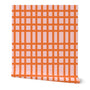 A roll of wallpaper with a checkered orange pattern over a pink base. Designed by artist Leila Simon Hayes.