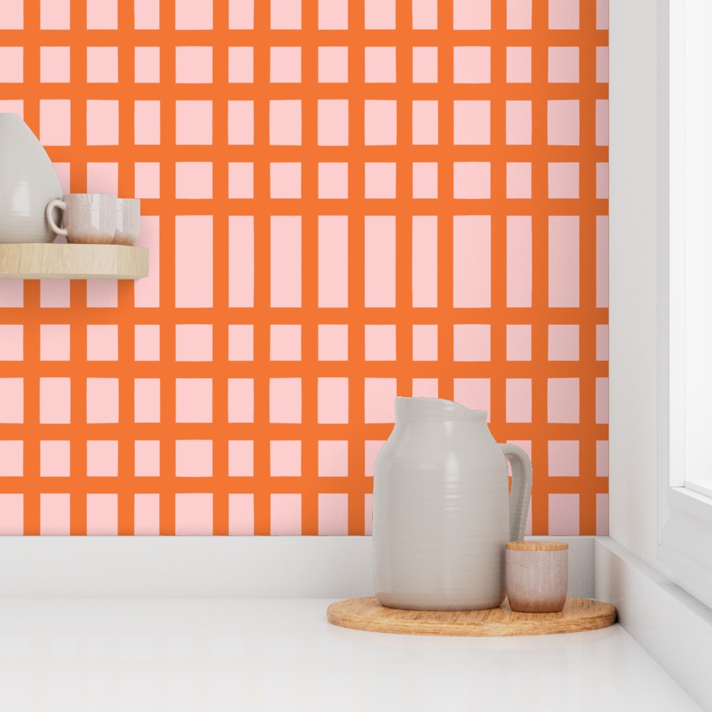 Kitchen counter with a pitcher and small container against an orange and pink checkered wall. Designed by artist Leila Simon Hayes.