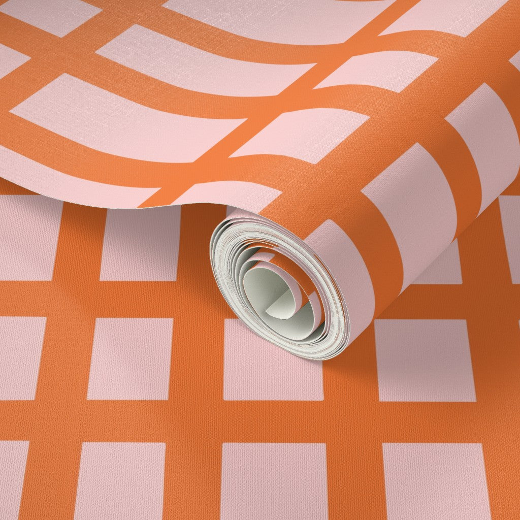 Roll of pink and orange patterned wallpaper. Designed by artist Leila Simon Hayes.