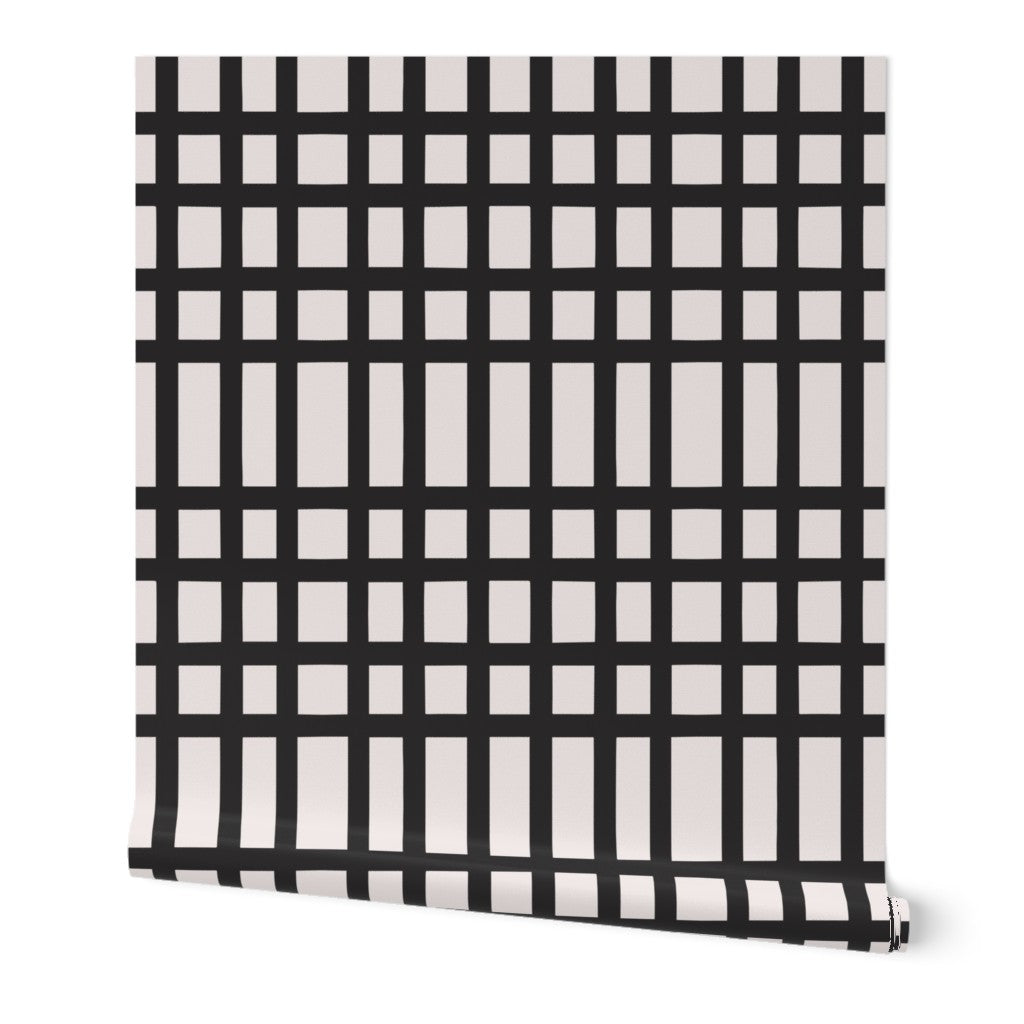 Roll of wallpaper with black and white grid pattern. Designed by artist Leila Simon Hayes. 