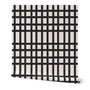 Roll of wallpaper with black and white grid pattern. Designed by artist Leila Simon Hayes. 