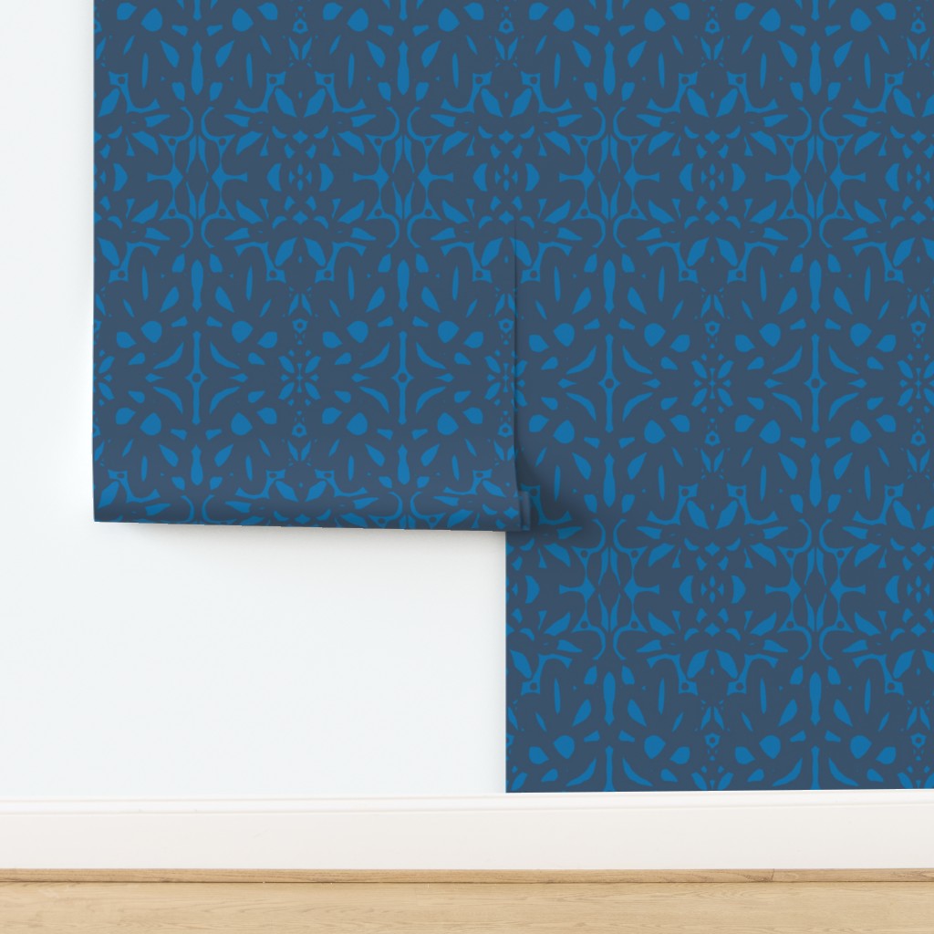 Roll of blue patterned wallpaper on a white background. Designed by artist Leila Simon Hayes.