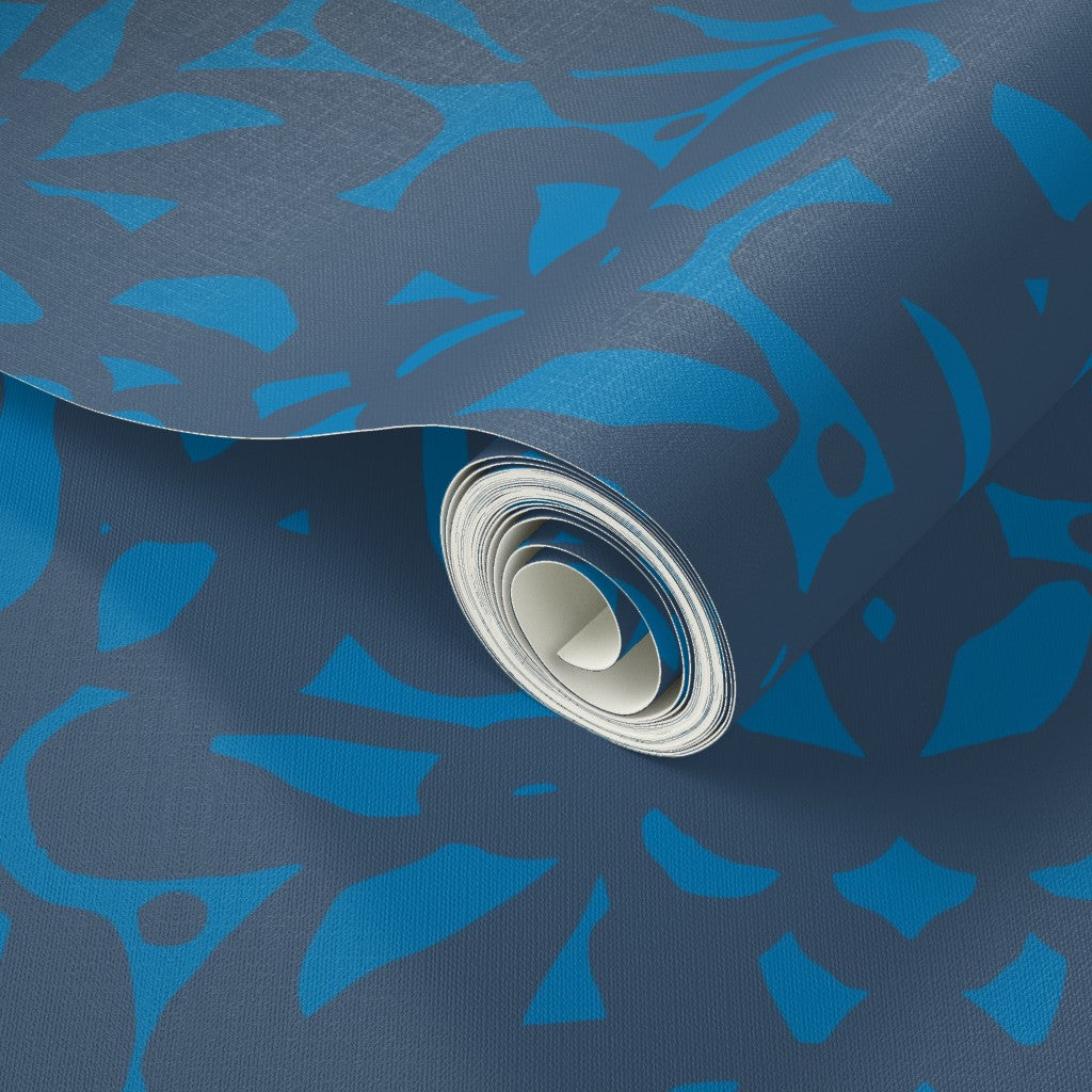 Roll of blue patterned paper with a close-up view. Designed by artist Leila Simon Hayes.
