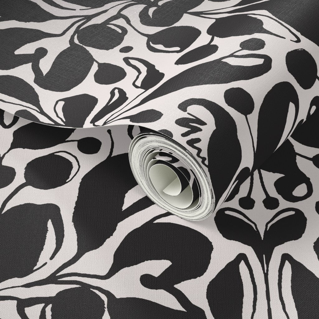 Roll of black and white patterned wallpaper with a close-up view. Designed by artist Leila Simon Hayes.