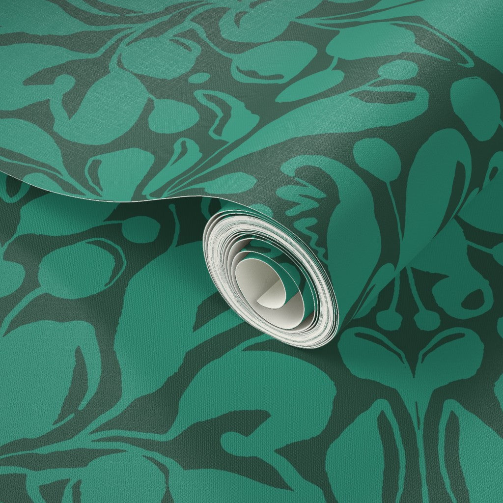 Roll of green patterned paper with a decorative damask design. Designed by artist Leila Simon Hayes.