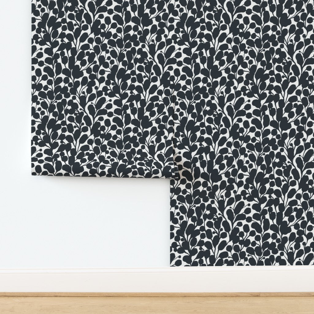 Roll of black and white wallpaper. Designed by artist Leila Simon Hayes.