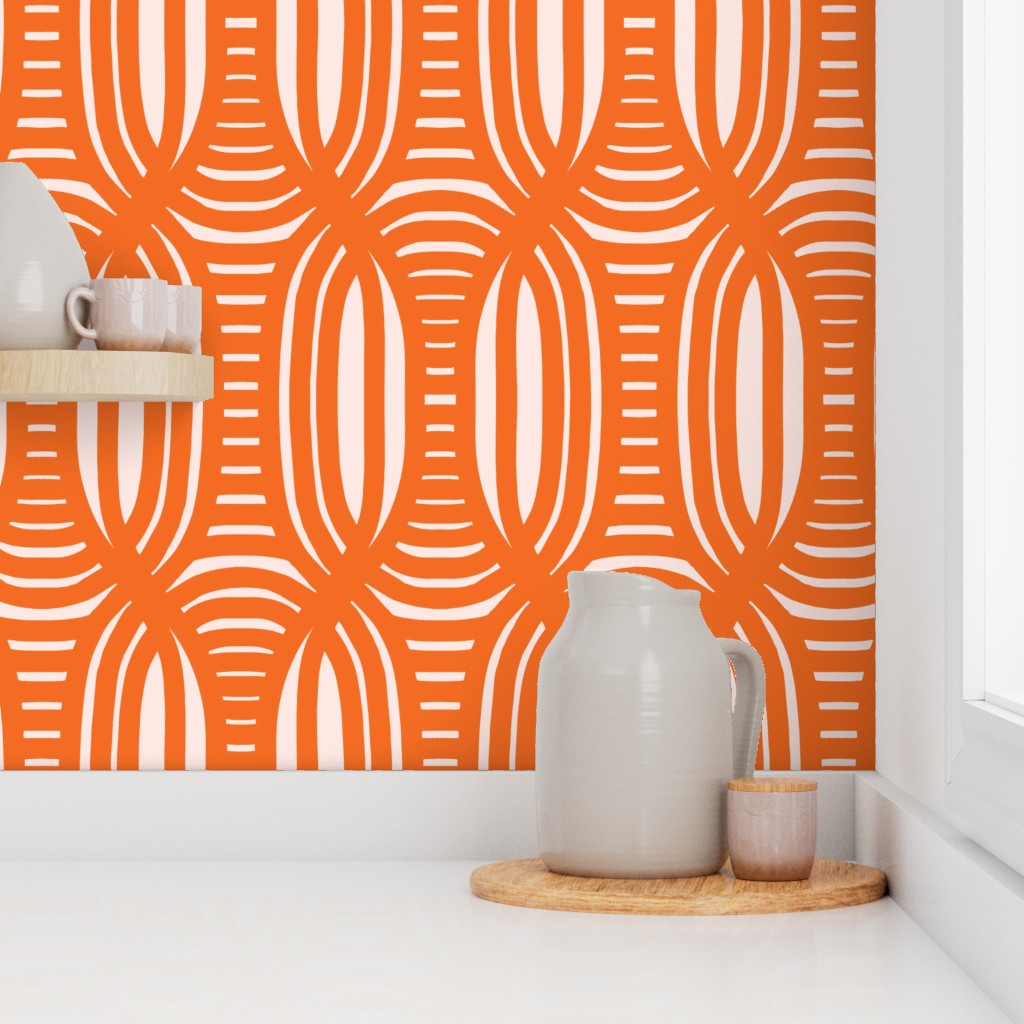Orange and white geometric patterned wallpaper with a pitcher and cups on a shelf. Designed by artist Leila Simon Hayes.