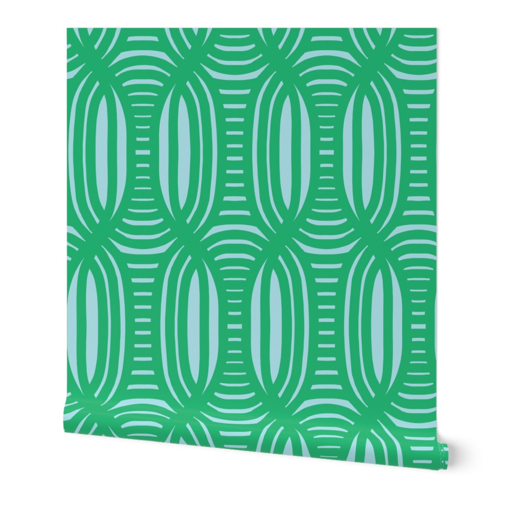 Roll of peel-and-stick geometrical wallpaper on a white background. The wallpaper has a bright green, wavy and intersecting, weave pattern over a light blue base. Designed by artist Leila Simon Hayes.