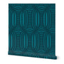 Roll of peel-and-stick geometrical wallpaper on a white background. The wallpaper has a dark blue, wavy and intersecting, weave pattern over a light blue base. Designed by artist Leila Simon Hayes.