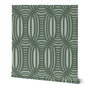 Roll of peel-and-stick wallpaper on a white background. The wallpaper is olive green, wavy and intersecting, weave pattern over a light sage green. Designed by artist Leila Simon Hayes.
