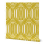 Roll of peel-and-stick geometrical wallpaper on a white background. The wallpaper has a yellow, wavy and intersecting, weave pattern over a light light yellow base. Designed by artist Leila Simon Hayes.