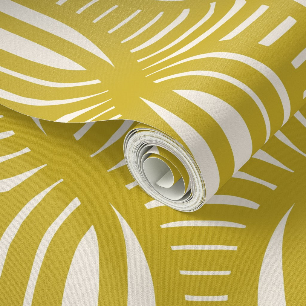 Roll of yellow wallpaper with white abstract patterns. Designed by artist Leila Simon Hayes.