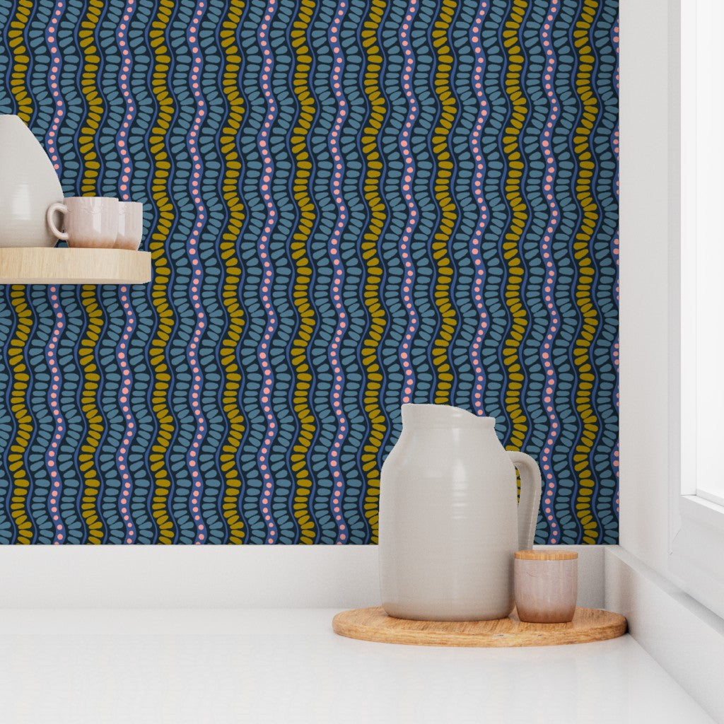 Kitchen scene with a pitcher and small container on a wooden tray against a patterned wall. Designed by artist Leila Simon Hayes. 