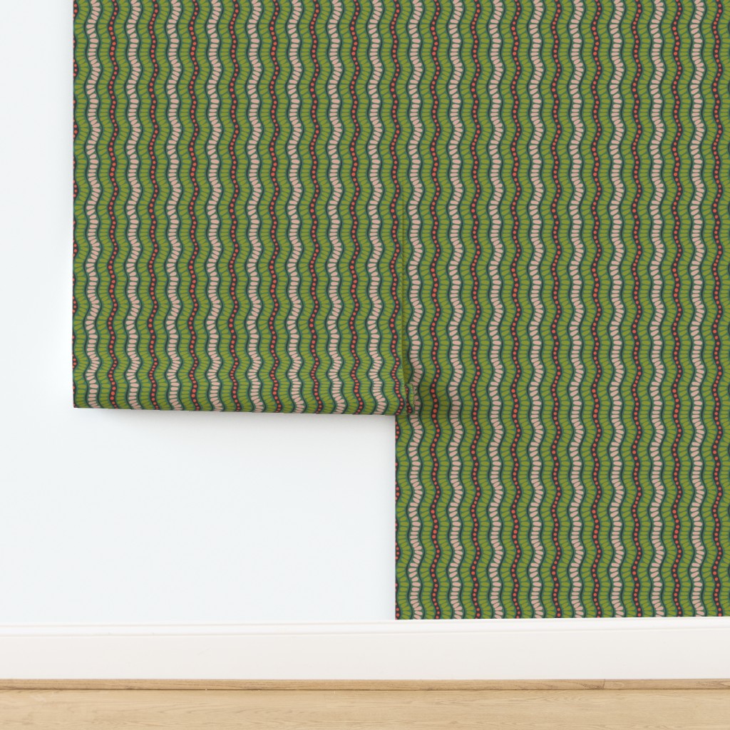 Green roll of wallpaper with a wavy pattern on a white background. Designed by artist Leila Simon Hayes. 