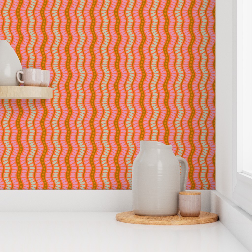 Decorative wallpaper with pink and orange wavy pattern in a room with ceramic jars. Designed by artist Leila Simon Hayes. 