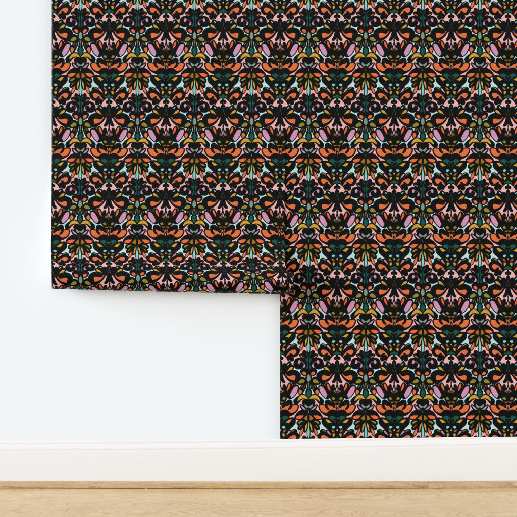 Roll of wallpaper with a colorful geometric pattern on a white background. Designed by artist Leila Simon Hayes. 