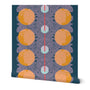 A roll of peel-and-stick wallpaper unraveled. The abstract wallpaper design has orange circular patterns and a central red line on a dark blue background. Designed by artist Leila Simon Hayes.