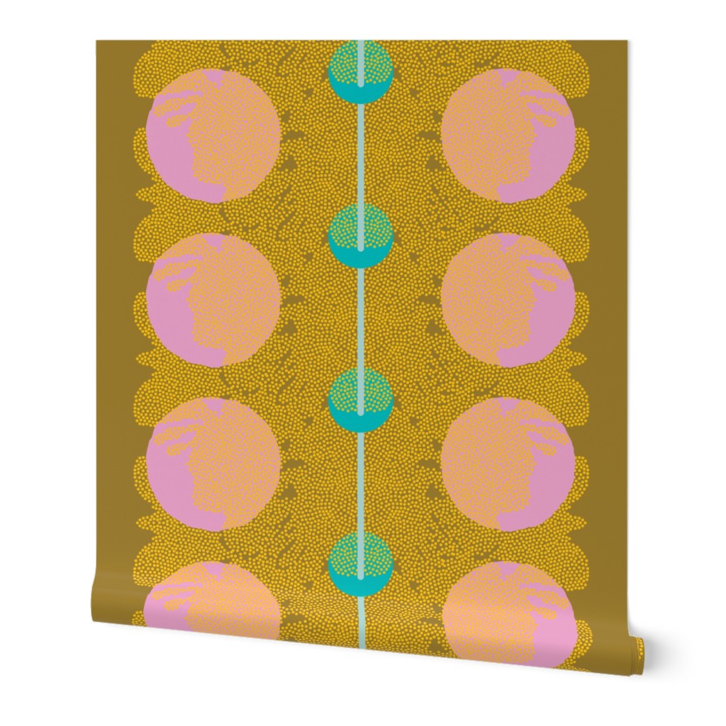 Roll of wallpaper with an abstract pattern of pink and blue circles and yellow dots on a dark yellow background, with a blue line down the middle. Designed by artist Leila Simon Hayes.