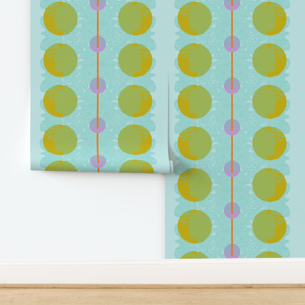 Patterned wallpaper with green circles on a light blue background. Designed by artist Leila Simon Hayes.