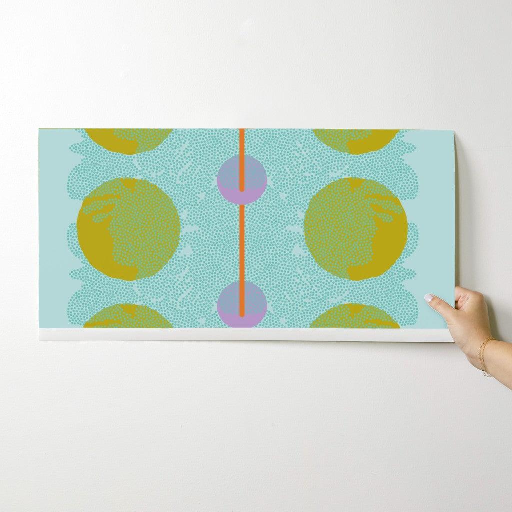 Wallpaper swatch with a colorful abstract design on a white surface. Designed by artist Leila Simon Hayes.