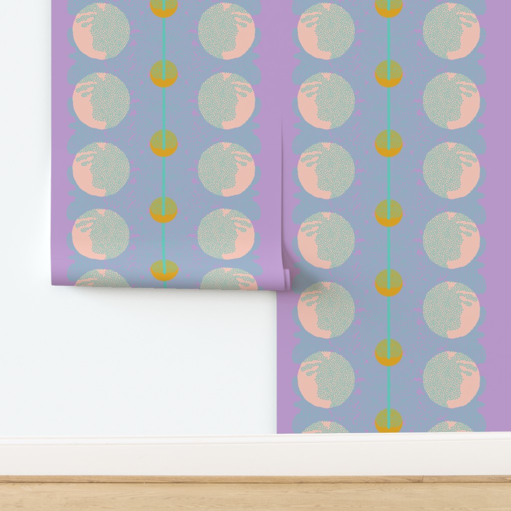 Roll of patterned paper with circular design on a purple background. Designed by artist Leila Simon Hayes.