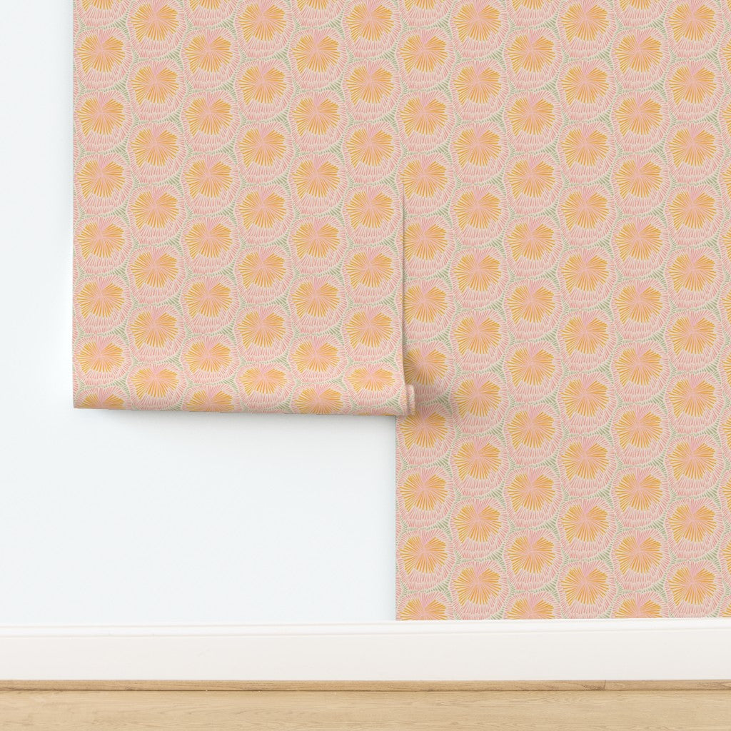 Roll of wallpaper with a sun burst pattern on a white background. Designed by artist Leila Simon Hayes.