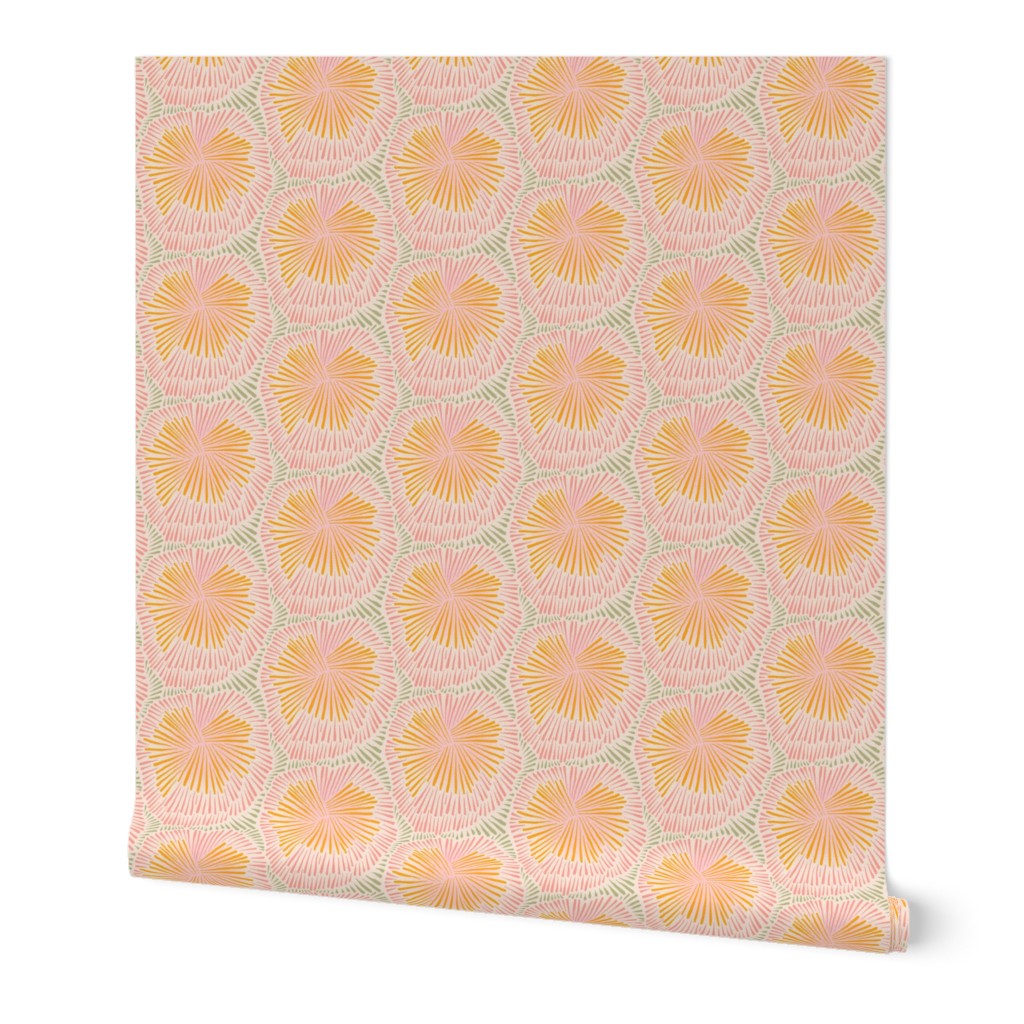 A roll of peel-and-stick wallpaper unraveled, on a white background. The abstract wallpaper design has pink, orange, and green firework, floral, designs on a white base. Designed by artist Leila Simon Hayes.