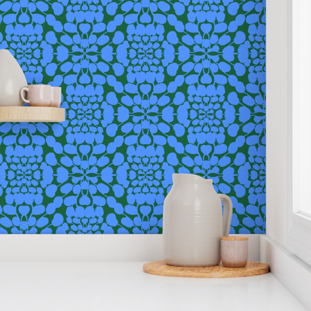 Kitchen scene with a blue and green patterned wall, white pitcher, and wooden tray. Designed by artist Leila Simon Hayes.
