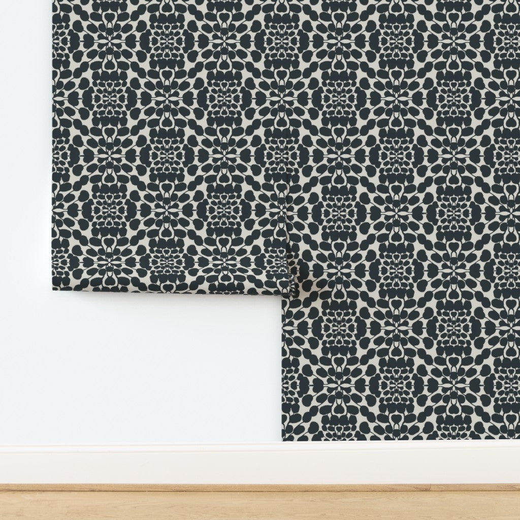 Patterned wallpaper with a geometric design on a white background. Designed by artist Leila Simon Hayes.