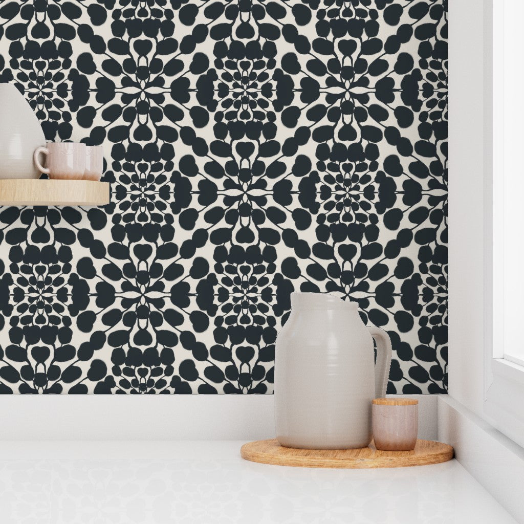 Patterned wallpaper with geometric design in a room with decor items. Designed by artist Leila Simon Hayes.
