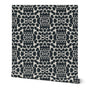 Black and white patterned roll of wallpaper on a white background. Designed by artist Leila Simon Hayes.