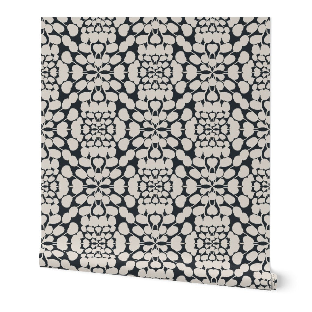 Roll of wallpaper with a black and white pattern on a white background. Designed by artist Leila Simon Hayes. 