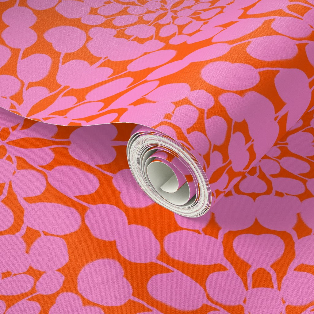 Roll of pink floral-patterned fabric on an orange background. Designed by artist Leila Simon Hayes. 